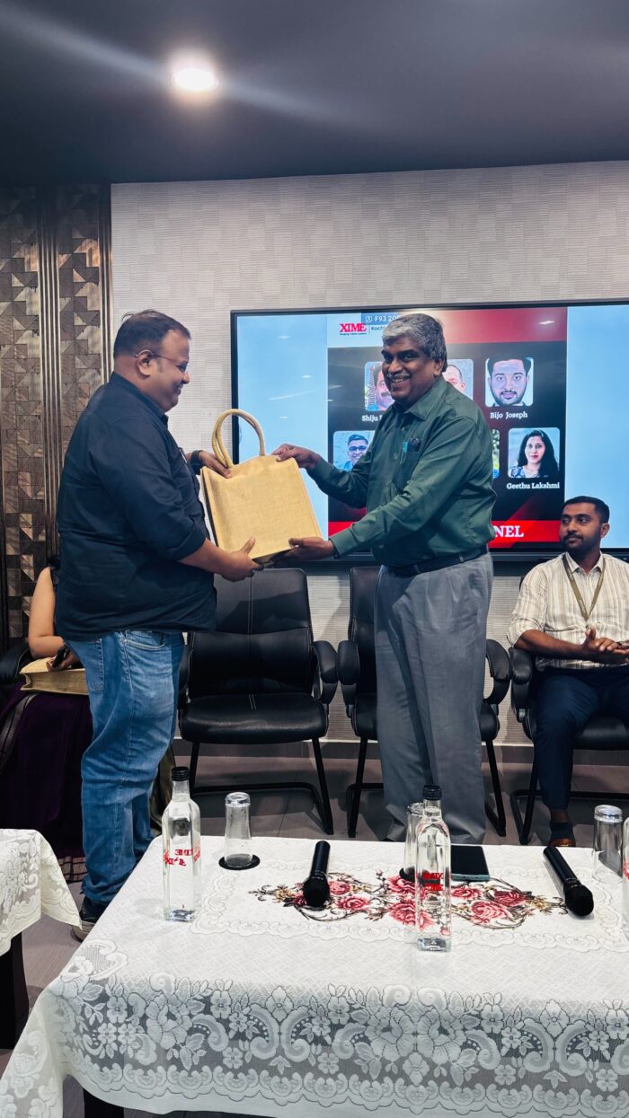 Arunanand T A (HR Bro) receiving a memento from Prof. A S Girish XIME Kochi